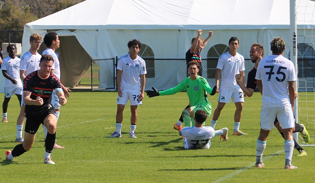 Declan Waters (left) of the Sarasota Paradise celebrates a goal against New York City FC II on Feb. 13 at Premier Sports Campus in Lakewood Ranch.
