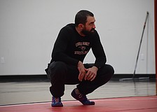 Coach Felix Osuna-Cotto oversees a Feb. 17 practice for Cardinal Mooney wrestling. He helped found the program last year, and in Year 2, the Cougars are poised to have multiple state qualifiers.