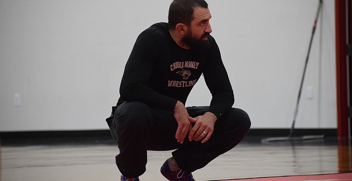 Coach Felix Osuna-Cotto oversees a Feb. 17 practice for Cardinal Mooney wrestling. He helped found the program last year, and in Year 2, the Cougars are poised to have multiple state qualifiers.