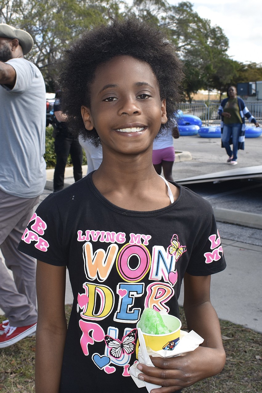 Third grader Dariana Mills enjoys a treat from Kona Ice.