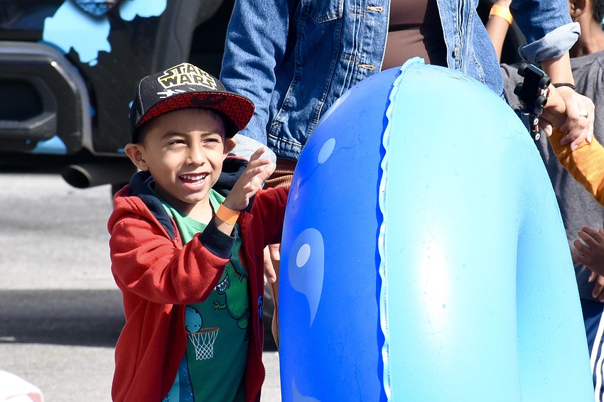 Kindergartener Gustavo Machuca Salazar prepares for the slide.