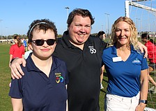 Ability to Include's Grace Murby and Chris Collins are thrilled with a $10,000 grant that was presented to them by Lakewood Ranch Community Foundation Executive Director Kate Mulligan to help build a universal soccer pitch.