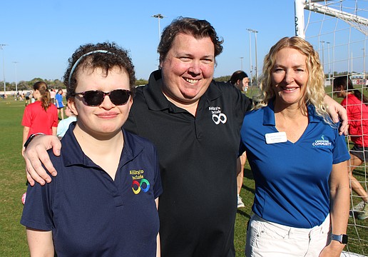 Ability to Include's Grace Murby and Chris Collins are thrilled with a $10,000 grant that was presented to them by Lakewood Ranch Community Foundation Executive Director Kate Mulligan to help build a universal soccer pitch.