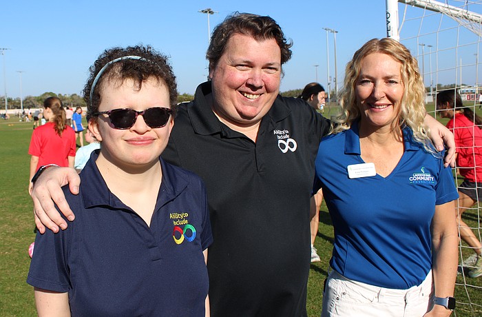 Ability to Include's Grace Murby and Chris Collins are thrilled with a $10,000 grant that was presented to them by Lakewood Ranch Community Foundation Executive Director Kate Mulligan to help build a universal soccer pitch.