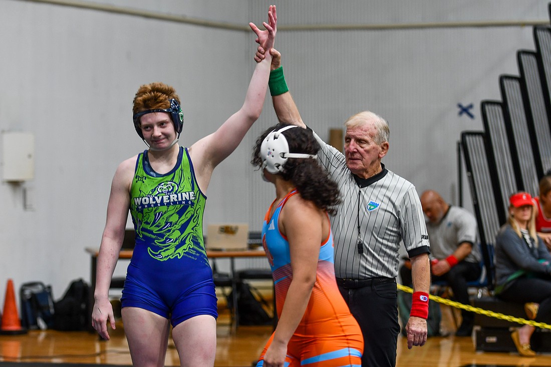 Windermere High’s senior wrestler Emily McCormack celebrated winning her 100th career wrestling match. She became the second Wolverine to reach the milestone and the first girl to do it.