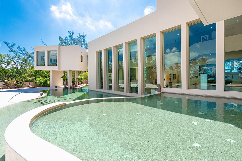 A lagoon-style pool provides a resort-like atmosphere while preserving privacy and water views. A lagoon-style pool provides a resort-like atmosphere while preserving privacy and water views.