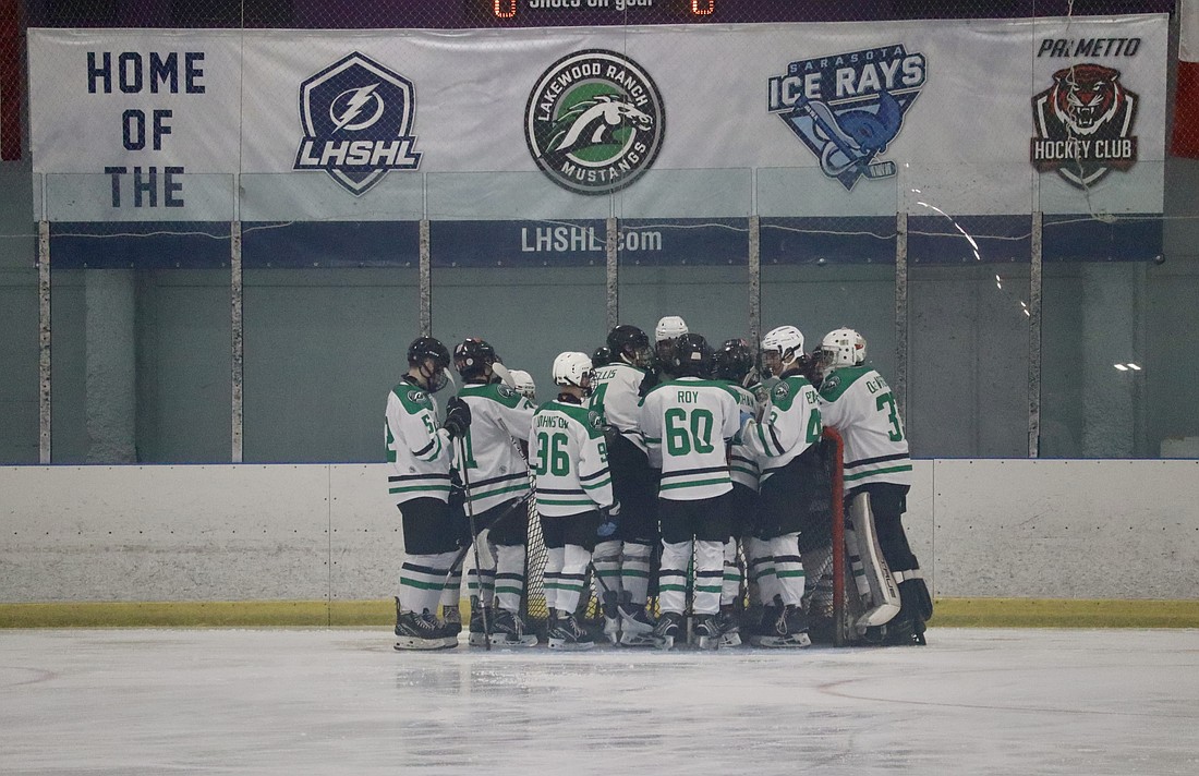 The Lakewood Ranch High School hockey team huddles together at the Ellenton Ice and Sports Complex in December. The team could call Lakewood Ranch home if an ice rink is built at Premier Sports Campus North.