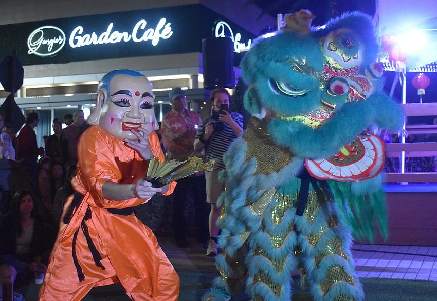 Members of the Mt. Song Martial Arts Academy from Tampa kick off the performances with a lion dance welcoming the year of the horse.