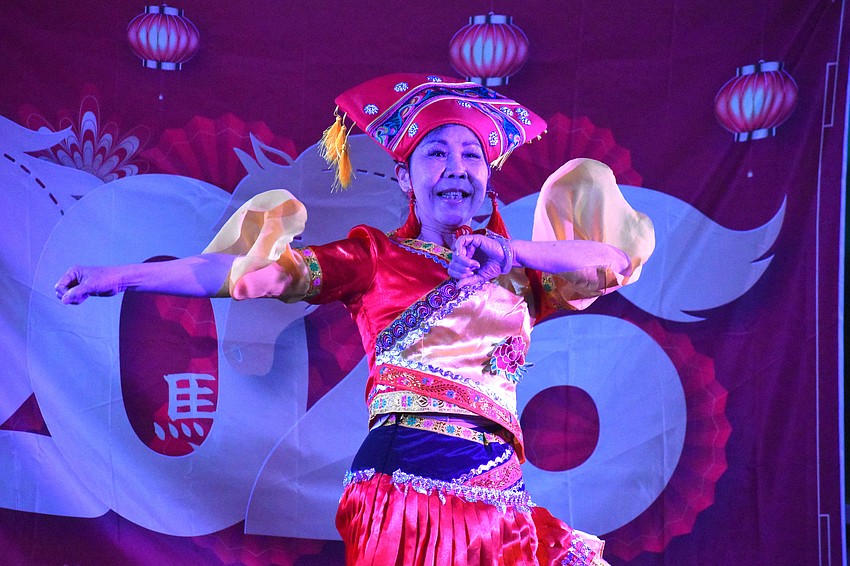 Fengming Wei of Tampa Sunshine Dance Group performs an ethnic dance of the Zhuang and Dai people at the Lunar New Year Celebration.