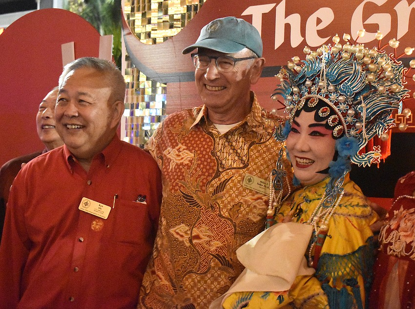 Sister Cities Association of Sarasota's Kun Shi and Miles Toder, along with performer Jie Yu, are glad so many people came out to celebrate the Lunar New Year.