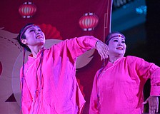 Weizhen Jiang Wolf and Yuhong Wan of Zen Rhythm Dance Group perform a Mongolian Dance at the Lunar New Year Celebration.