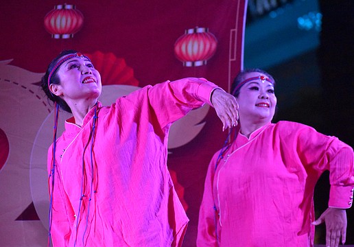 Weizhen Jiang Wolf and Yuhong Wan of Zen Rhythm Dance Group perform a Mongolian Dance at the Lunar New Year Celebration.