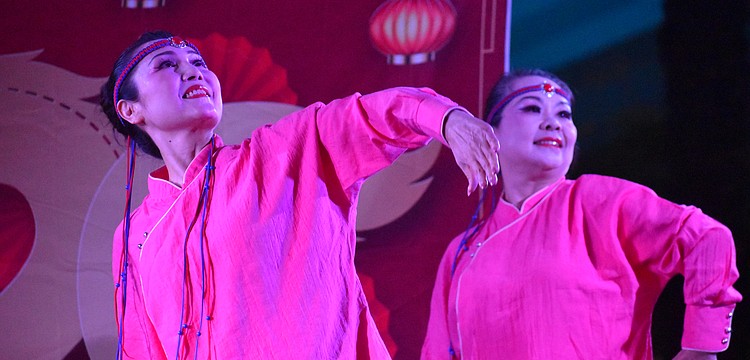 Weizhen Jiang Wolf and Yuhong Wan of Zen Rhythm Dance Group perform a Mongolian Dance at the Lunar New Year Celebration.