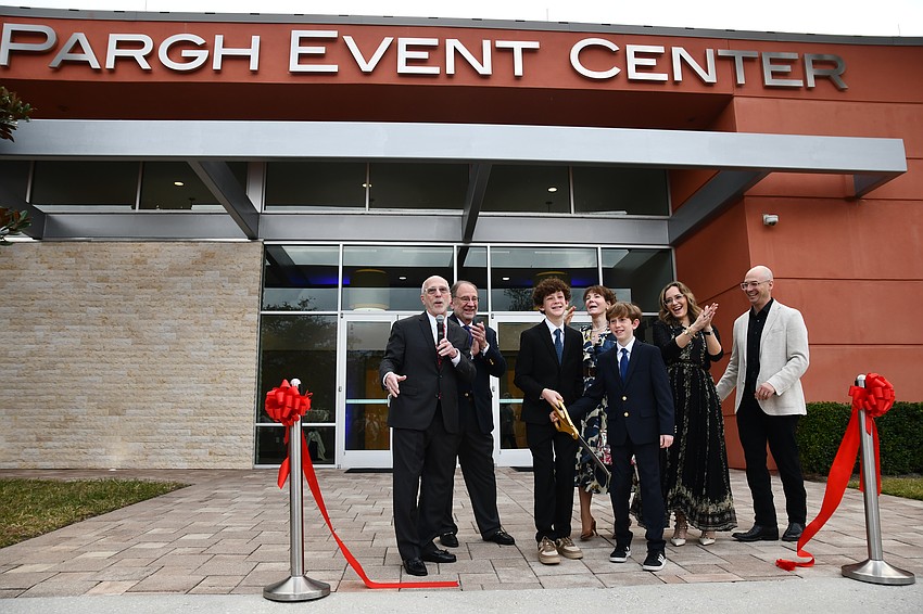 Andy Pargh, left, celebrated unveiling the renamed Pargh Event Center. The center will build a venue for the arts to serve the Southwest Orange community.