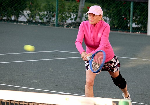Terry Creighton lines up a shot at a Feb. 15 tennis session at The Sanctuary.