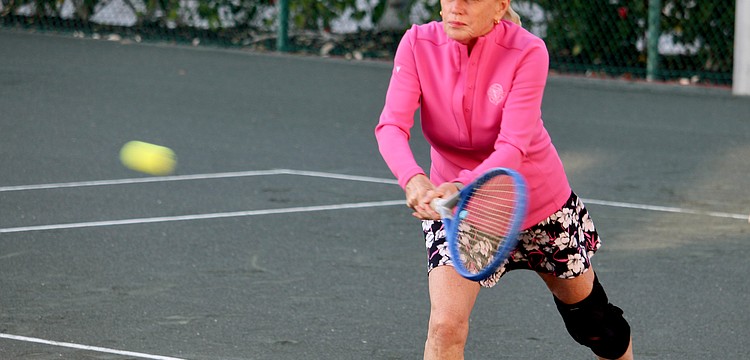 Terry Creighton lines up a shot at a Feb. 15 tennis session at The Sanctuary.