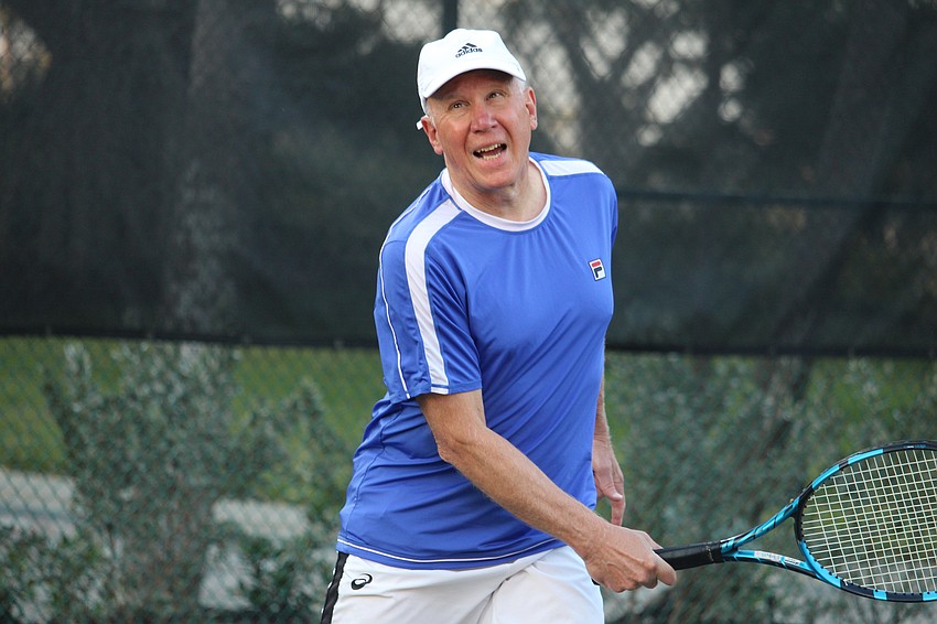 Bob Kriss follows through on his swing.