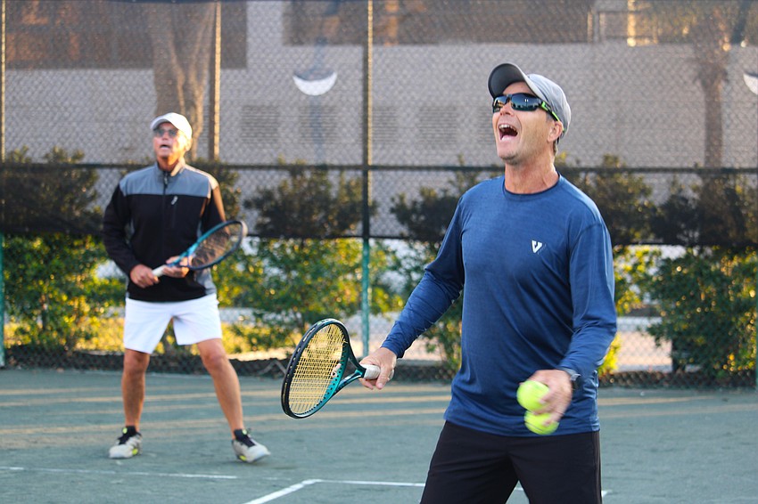 Racquet Sports Professionals Association-certified tennis pro Claudiu Retean gives an enthusiastic cheer as one of The Sanctuary at Longboat Key Club Community Association members makes it to the ball in time.