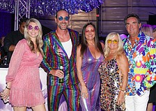 Melissa Douberly, Tyson Babb, Lisa Jayne Warren-Wallace and Gina and David Warren dig the vibe of the Studio 54 theme and the cocktail hour.