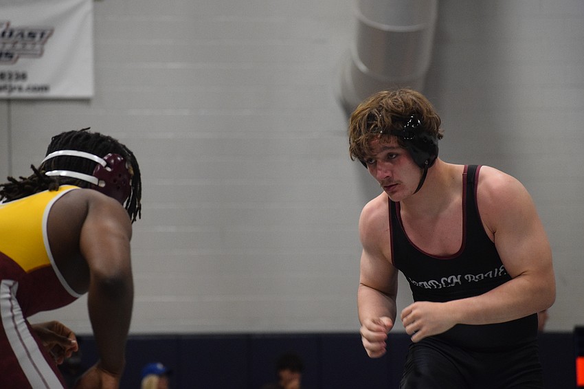 Logan Pike (right) was one of five Pirates to top the podium at the district championship. Joining him in that regard were senior Jaden Morales at 126, senior Jacob Fuentes at 144, senior Evan Rowe at 165 and junior Freedom McDaniel at 215.