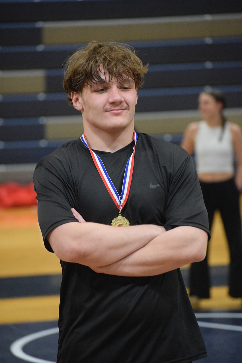 Logan Pike used wrestling to battle childhood obesity, and despite two ACL injuries since getting involved as a fifth-grader, has stuck with the sport.