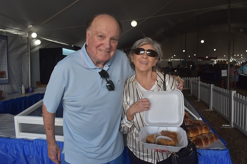 Sarasota's Ron and Pat Pantello purchase Baklava and Galatoboureko from the pastry booth at the St. Barbara 42nd Annual Greek Festival. Ron is half Greek and has been eating Greek food for 70 years and doesn't plan to stop anytime soon.