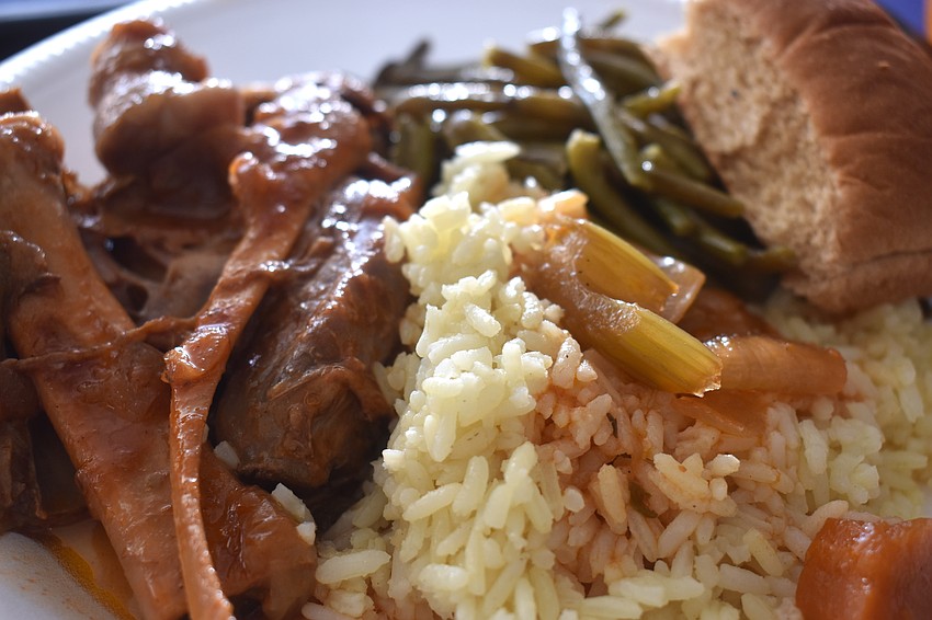 The dinner entree of oven roasted lamb shank, rice, green beans and a roll is among the many food options available at the St. Barbara 42nd Annual Greek Festival.