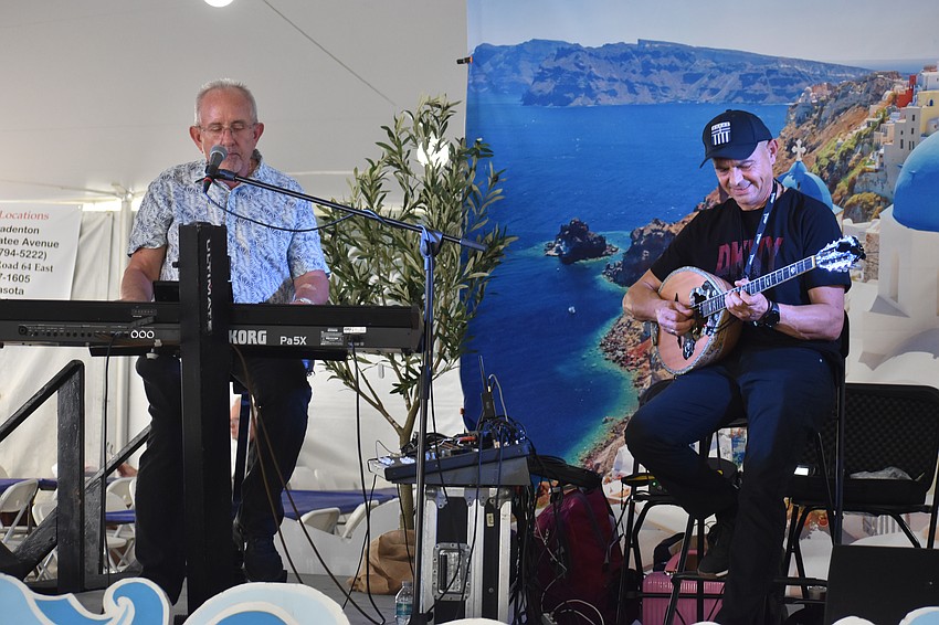 Dino Theofilos plays keyboard and Simos Nikolopoulos plays bouzouki as part of the band Ellada at the St. Barbara 42nd Annual Greek Festival.