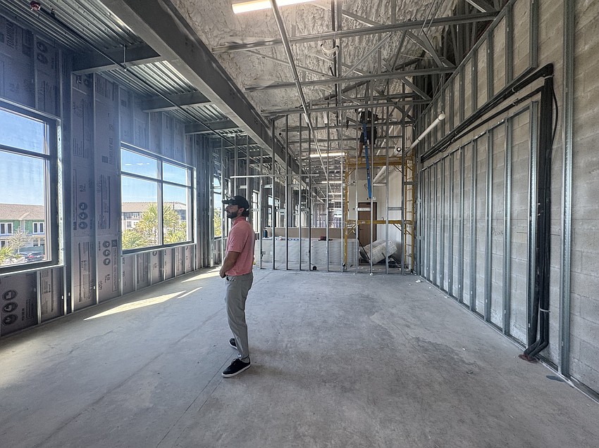 AvSky Corporation CEO Tyler Holt tours the office while it is under construction in Wellen Park.