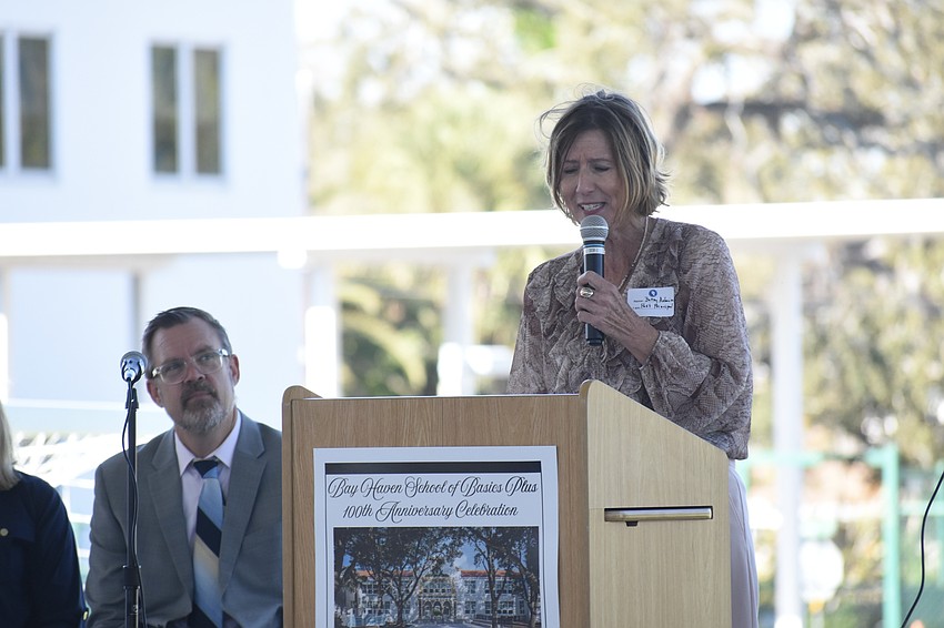Principal Chad Erickson listens as former Primcipal Betsy Asheim (2007-2013) speaks to attendees.