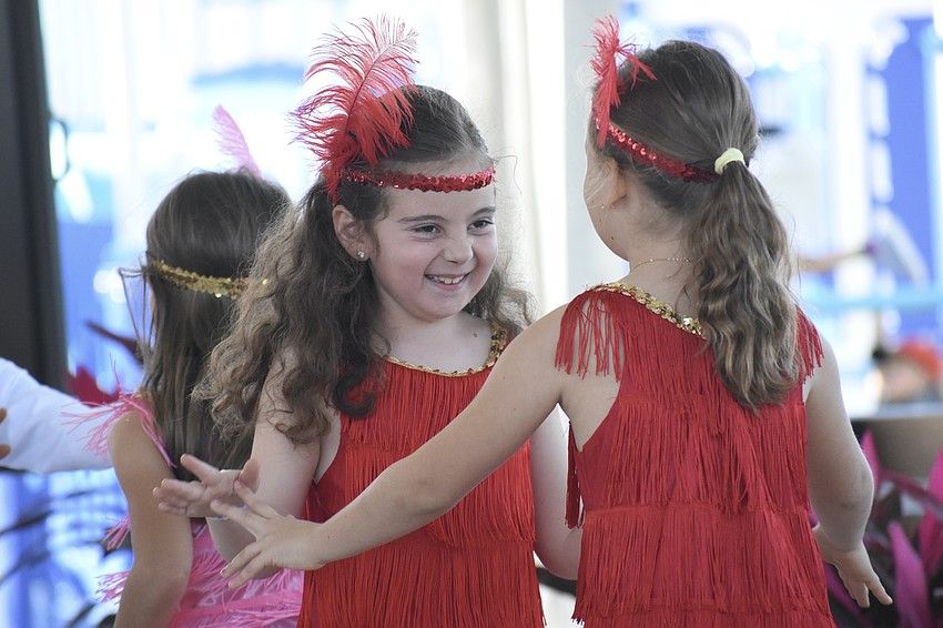 Second graders Amelia Johnson and Vera Bische dance the Charleston with the Bay Haven Broadway Club.