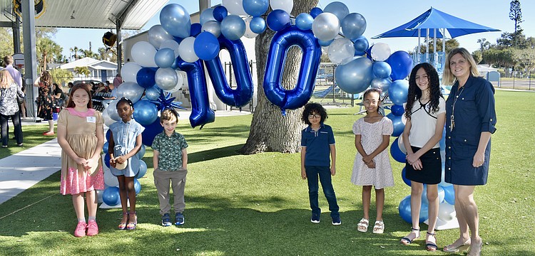 The winners of an essay contest had the chance to read out their essays during the event, and they included fourth grader Lorelei Martin, second grader Olivia Batista, kindergartener Logan Hernandez, third grader Petronius Boles, first grader Jade Rivers and fifth grader Amara Berry, pictured here with Assistant Principal Jennifer Kahler.