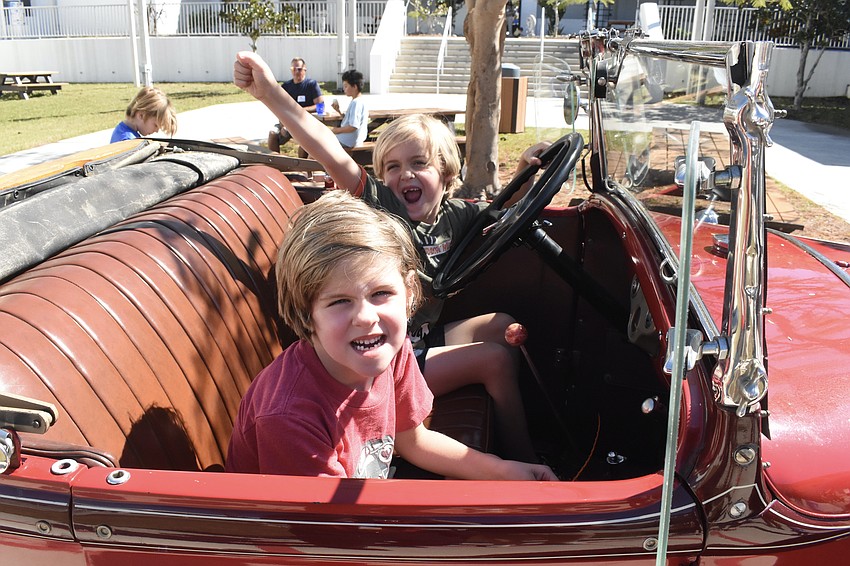 Judah Means, 6 (front) and Jordan Means, 6 (back) enjoyed sitting in the 1926 Ford Model A from Suncoast Technical College.