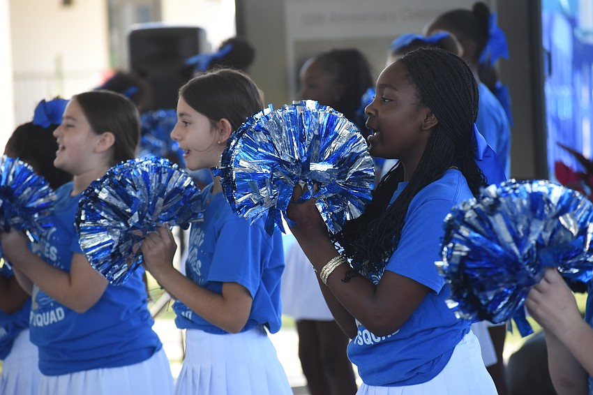 Fifth graders Cora Thomason, Hana Alimema and Derriale White of Bay Haven Cheer perform during the event.