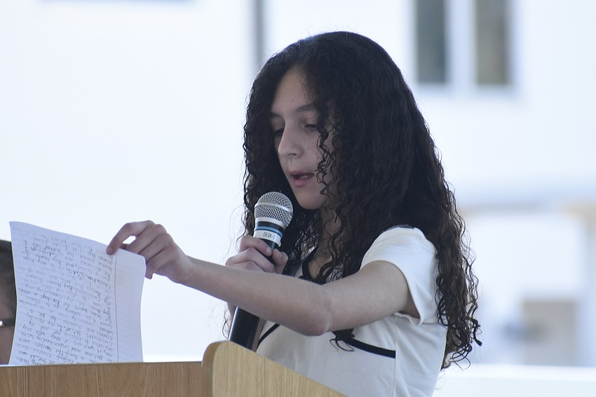 Fifth grader Amara Berry reads her essay.