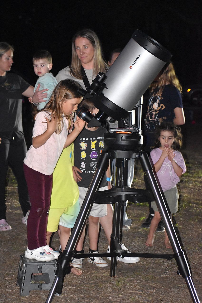 Lakewood Ranch's Eva Malysheva, 6, says she got to see Jupiter through the telescope. Her favorite planet is Saturn because of the rings.
