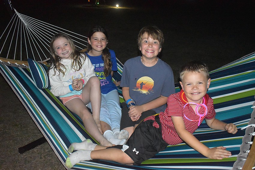 Lakewood Ranch's Zyla Piercy, Claire Haertel, Jase Piercy and Jacob Haertel are camping in style with a hammock to lounge in.