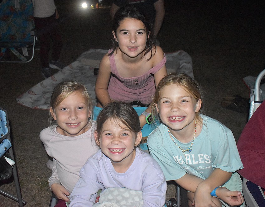 Addison Vosler, Lana Gagnon (back), Genevieve Dreyer and Avery Zych are eager to watch the Disney movie 