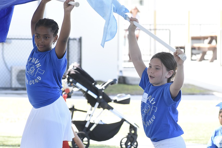 Third graders Takira Davis and Kimber Biggs of the Bay Haven Color Guard offer a performance.