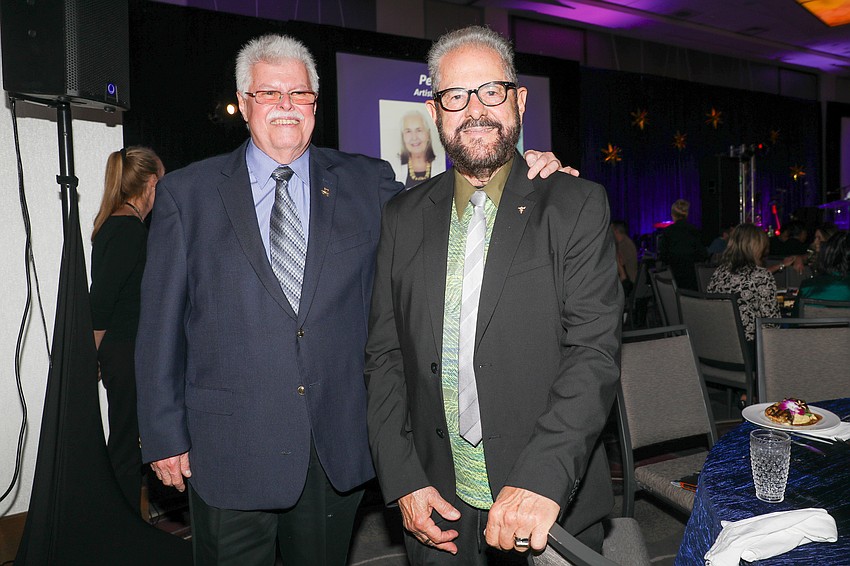 Pedro Schuck and honoree Marcos Carvajal who is an artist and cancer survivor.