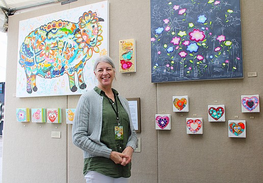 Artist Kathleen Murphy Willer, based in Menomonee Falls, Wisconsin, said she has fun incorporating elements evocative of childhood in her acrylic paintings. She was one of the artists to brave the sun and rain at last weekend's fine art festival on Longboat Key.