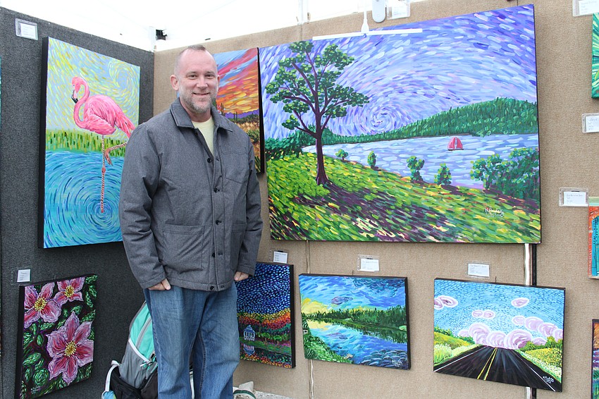 Lenny Hoffman, of Picofsky Hoffman Studios, LLC, said the art piece to his lower left depicting a lake in Washington State holds special meaning for him and his wife, Natasha Picofsky, who originally photographed the scene.