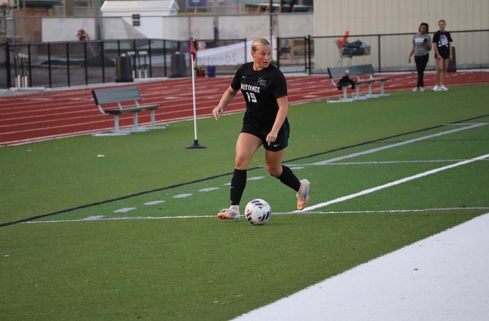 Senior forward/defender Rheanne Fleming looks for a pass during the FHSAA Class 6A-Region 3 championship Feb. 17 between Lakewood Ranch and East Lake. It proved to be the Mustangs' final win of 2025-26.