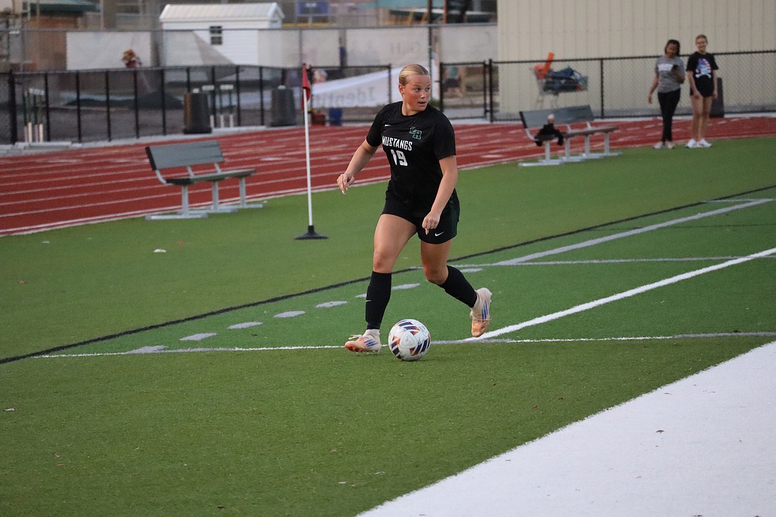 Senior forward/defender Rheanne Fleming looks for a pass during the FHSAA Class 6A-Region 3 championship Feb. 17 between Lakewood Ranch and East Lake. It proved to be the Mustangs' final win of 2025-26.
