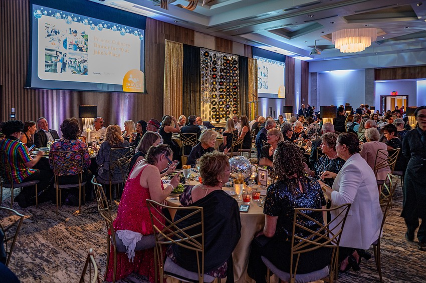The guests sit down for dinner.