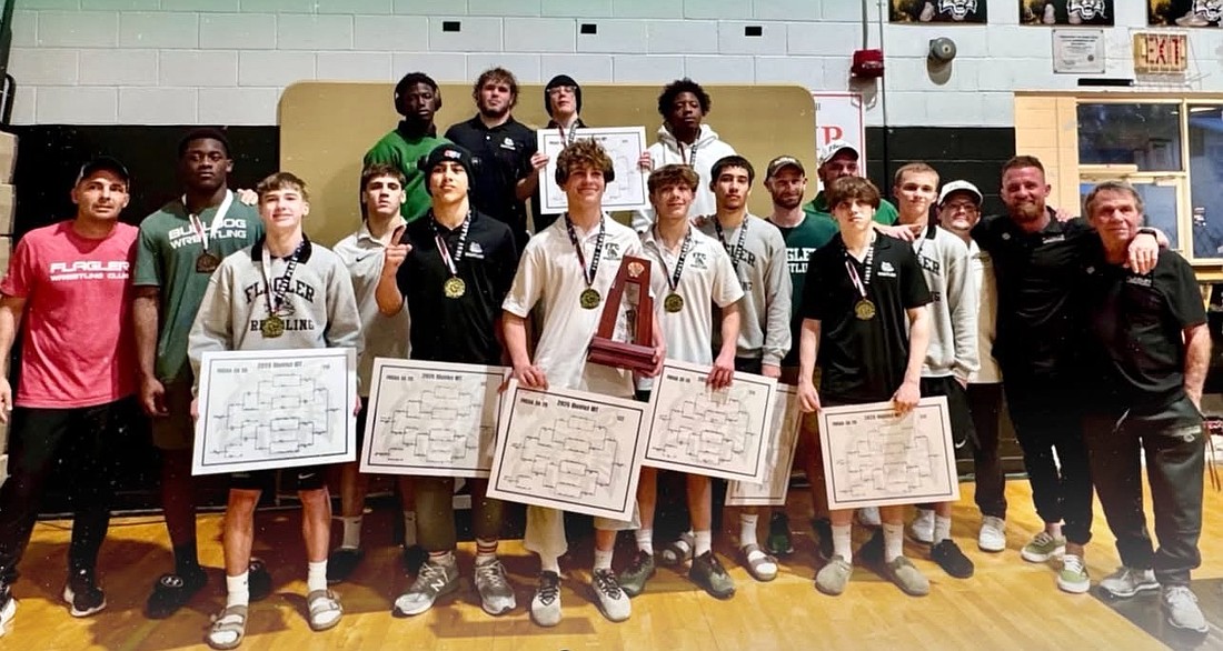 District champ Flagler Palm Coast is sending all 13 wrestlers to regionals, led by weight class winners (holding their brackets): Braden Dailey, JoJo Foalima, Jacob Hald (back row), Trey Twilley, Kevin McLean, Gabe Moy and Lenny Fries. Courtesy phooto