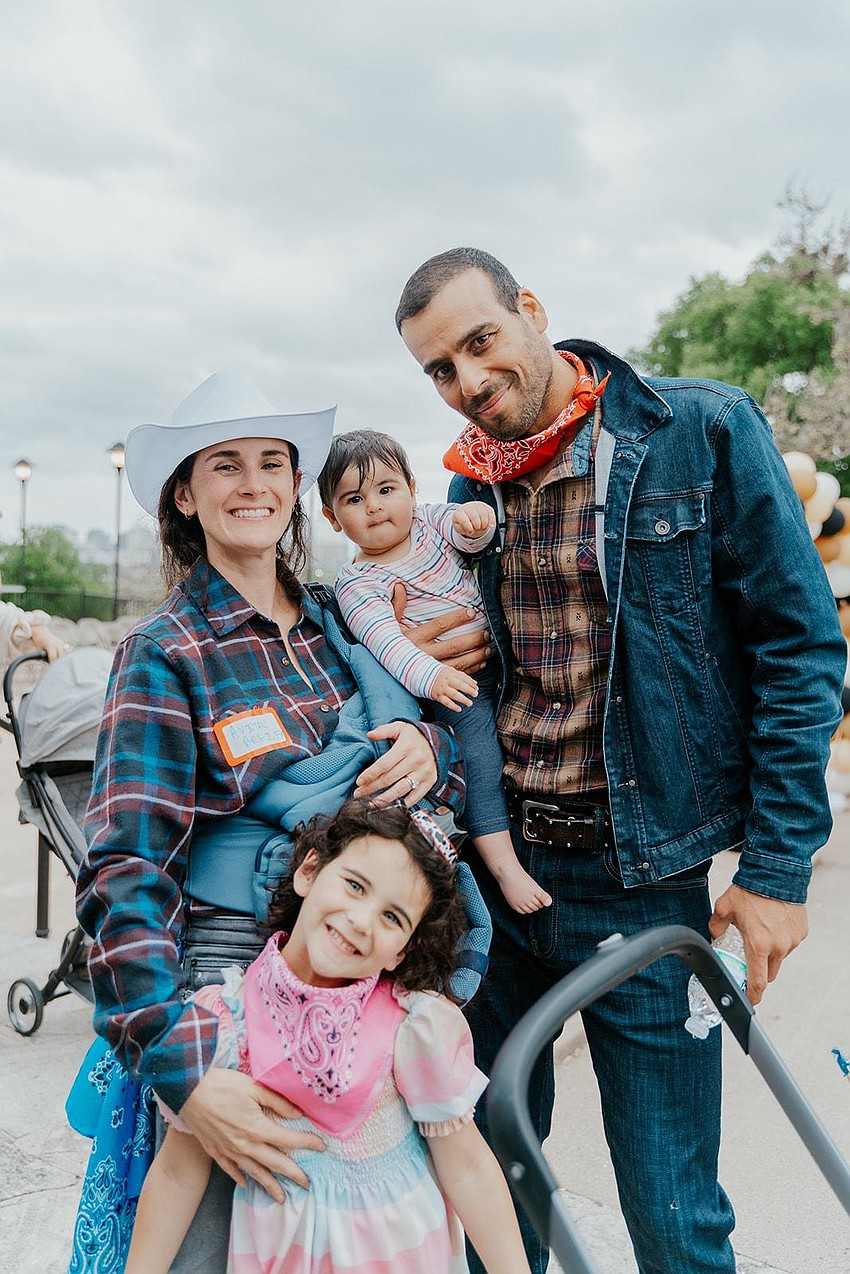 Avi and Asaf Breier, with their two daughters. Courtesy photo Avi and Asaf Breier, with their two daughters. Courtesy photo