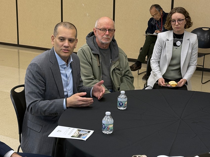 Sarasota City Manager candidate Christopher Rodriguez speaks with residents during the roundtable portion of the open house at Robert L. Taylor Recreation Center.