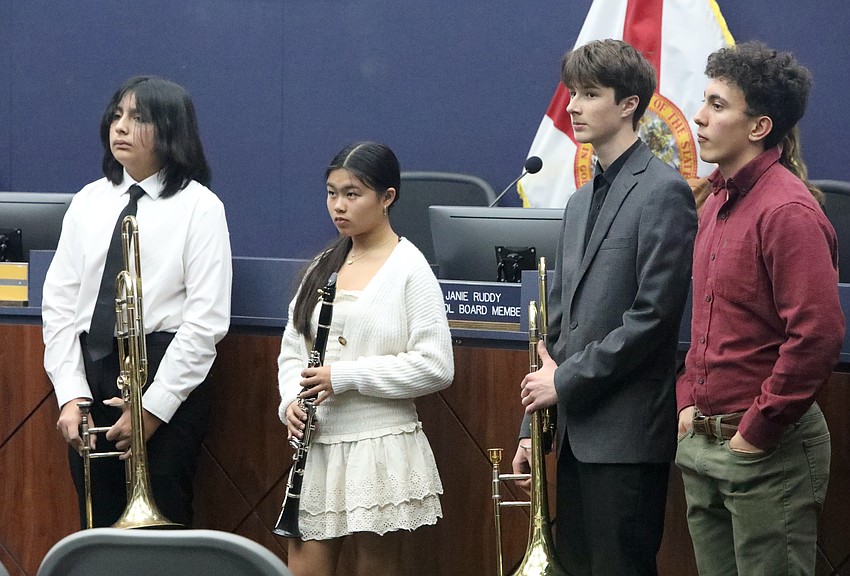 The Flagler County School Board honored All-State Middle School Band members Joshua Palacious (trombone) and Emily Rhee (clarinet), both of Indian Trails Middle School, and All State High School Band members George Biedenback (trombone) of Matanzas and Flagler Palm Coast's Oliver Esquival-Novak (alto saxophone). The four students played the national anthem before the board's Feb. 24 meeting. Photo by Brent Woronoff