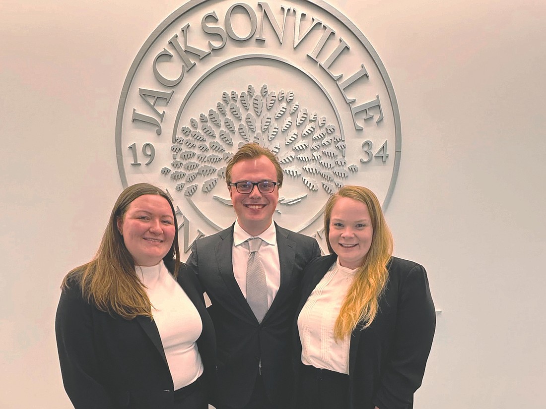 From left, Courtney Crain, Thomas Driggers and Taylor Deckard represented Jacksonville University College of Law in both the written and oral argument rounds of the National College Athletics Infractions Hearing Competition hosted by the University of Iowa. Not shown: their classmate, Dalton Cates, entered only the written portion of the competition.